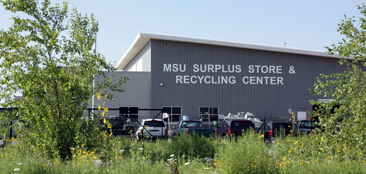 A spring time photo of the MSU Surplus Store and Recycling Center