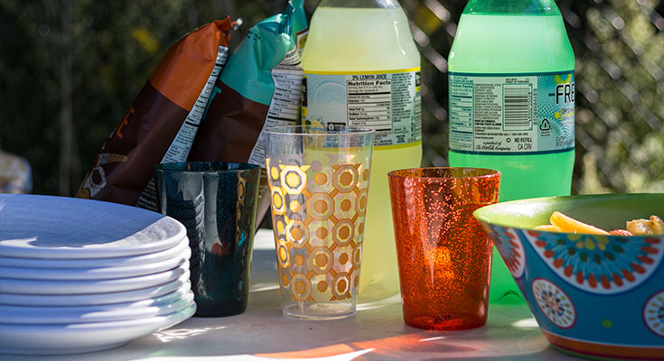 A photo of plastic dishware and refreshments.