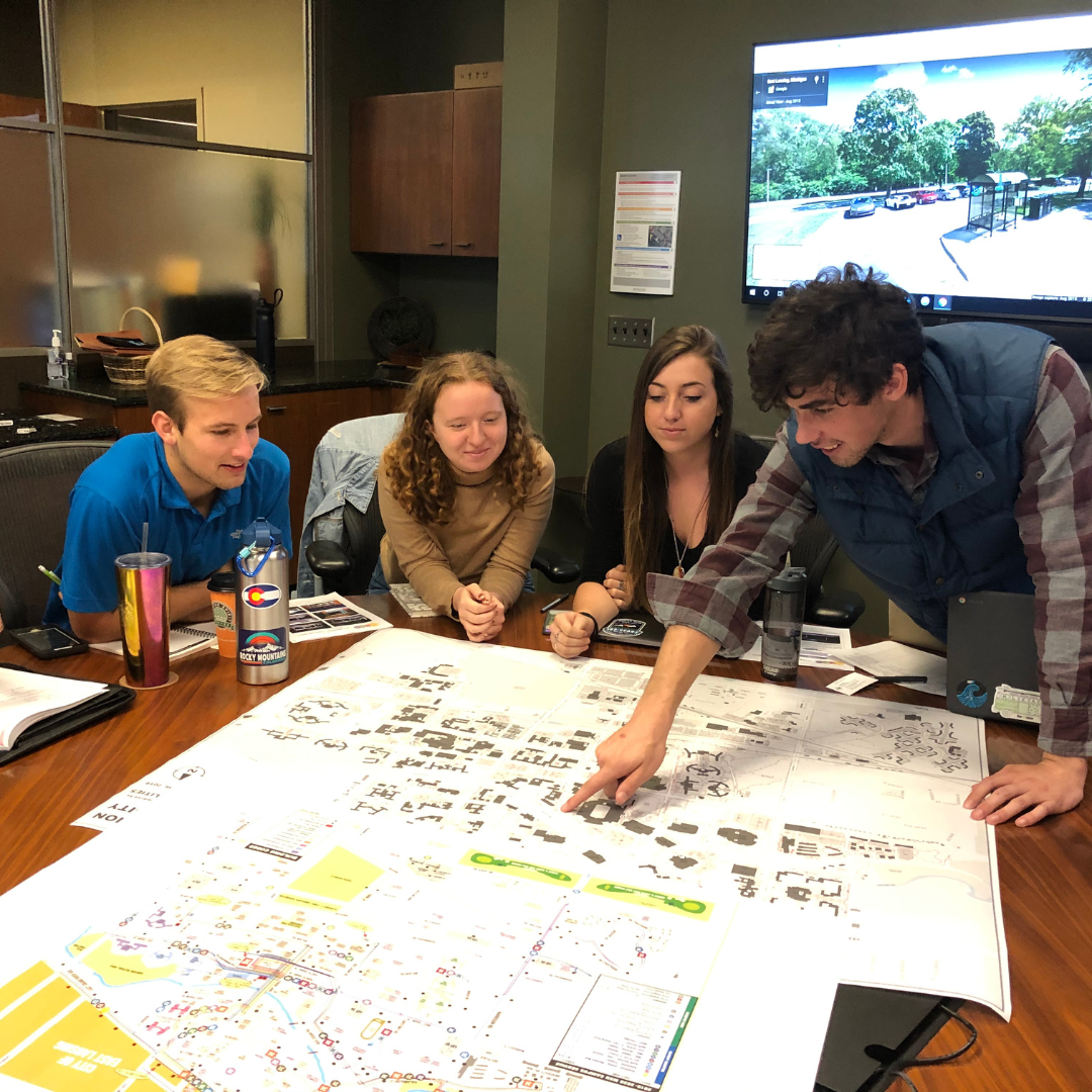 Students looking at a campus planning map