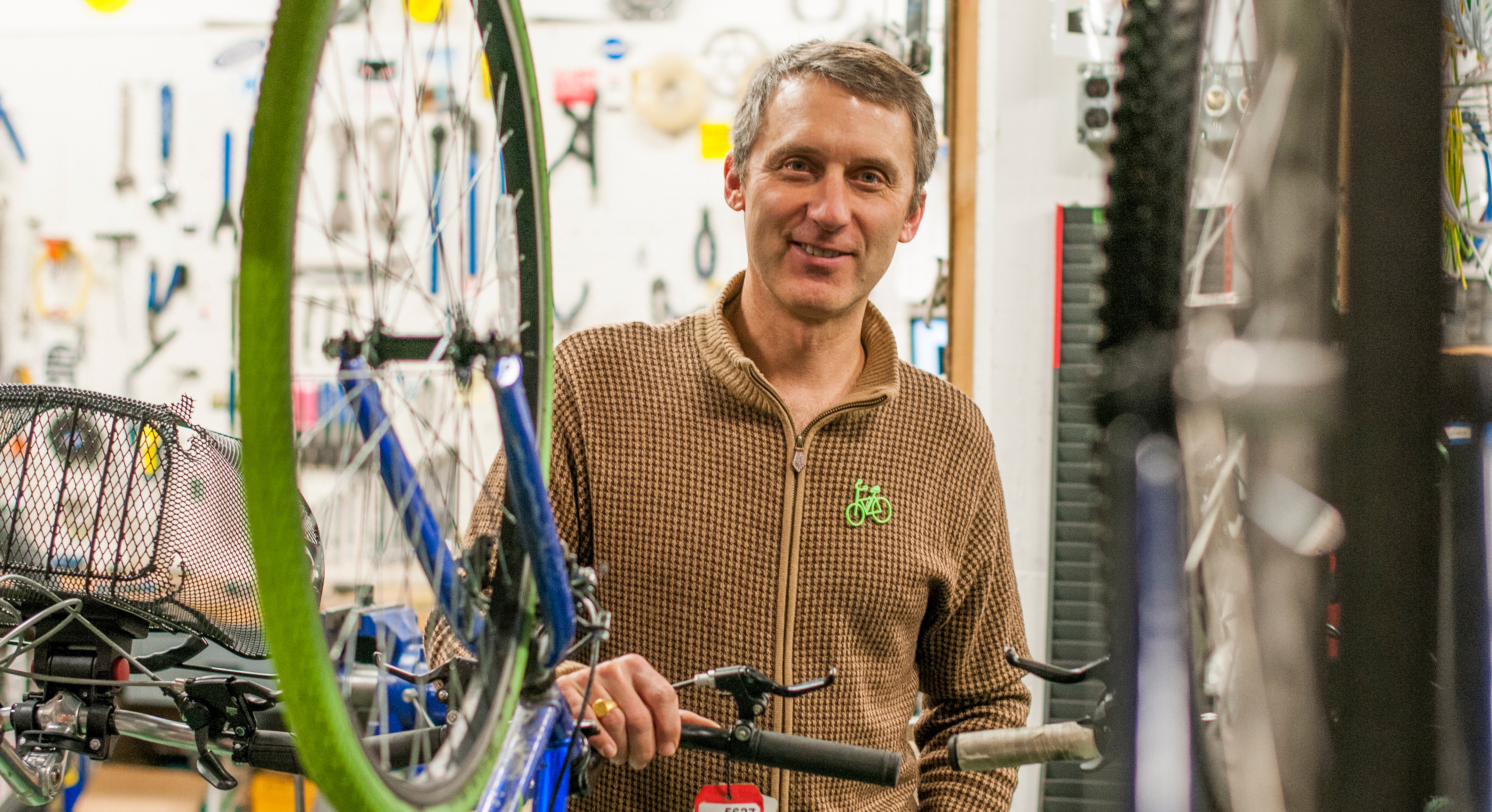 A photo of Tim Potter, sustainable transportation manager, in the MSU Bikes Service Center.