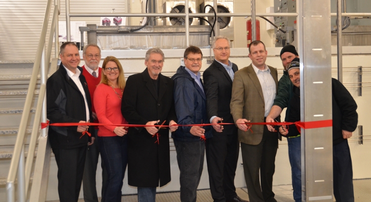 Several East Lansing City Council members and staff cutting the ribbon to the East Lansing Water Resource Recovery Facility in celebration of the completion of Phase one updates made at the facility.