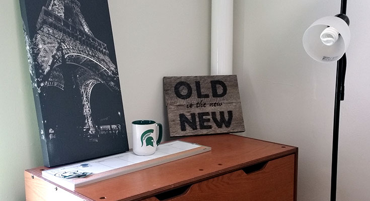 A photo of a residence hall room that features decor purchased at the MSU Surplus Store.